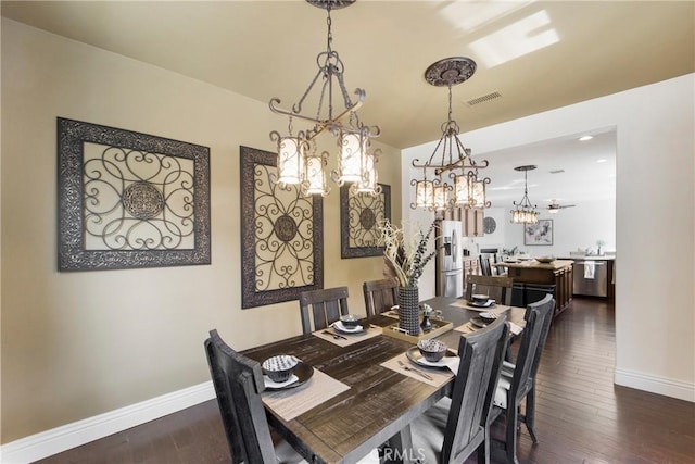 dining space with dark wood-type flooring