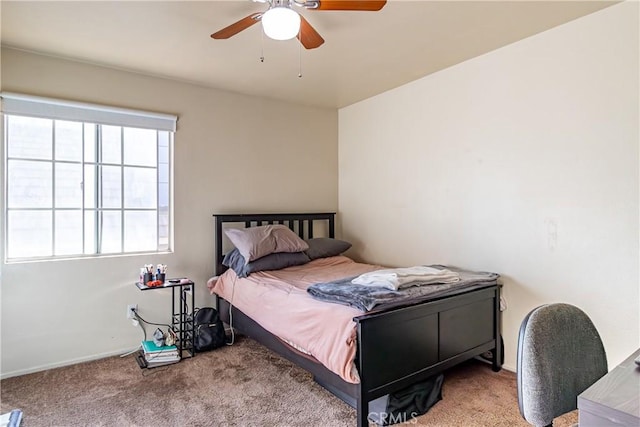 bedroom with ceiling fan and carpet