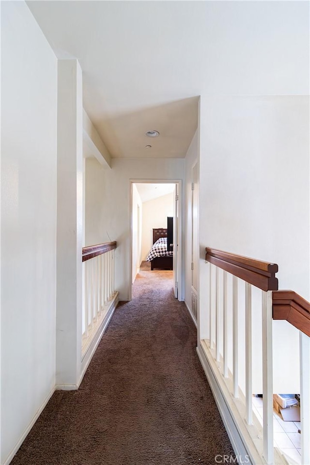 corridor with carpet flooring