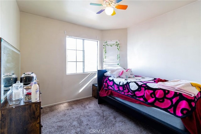 bedroom with ceiling fan and carpet flooring