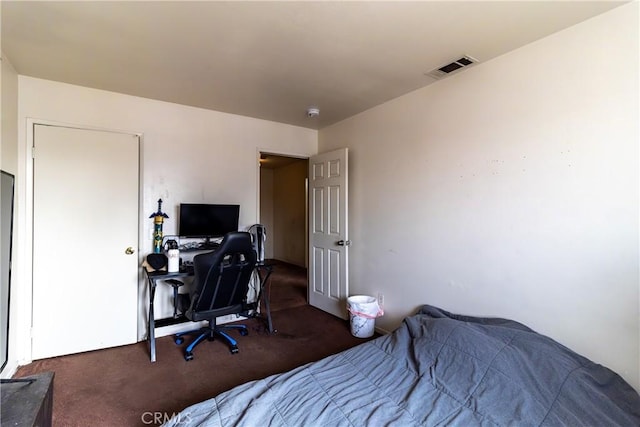 bedroom featuring dark carpet