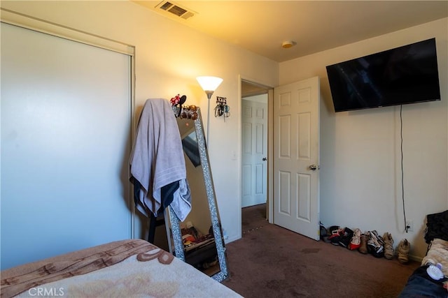 unfurnished bedroom featuring dark colored carpet