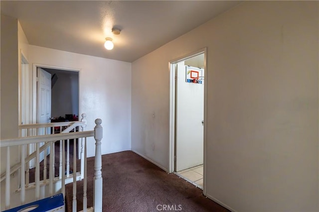 hallway with carpet flooring