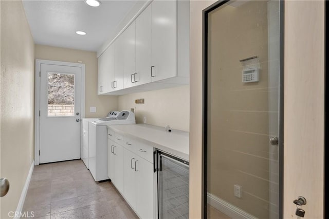 washroom with cabinets and wine cooler