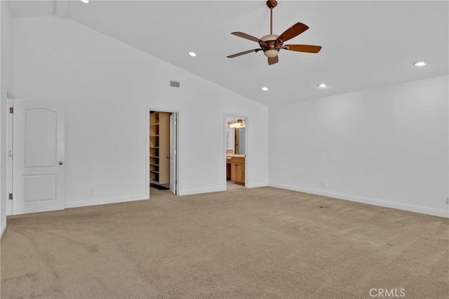 interior space with light carpet, high vaulted ceiling, and ceiling fan