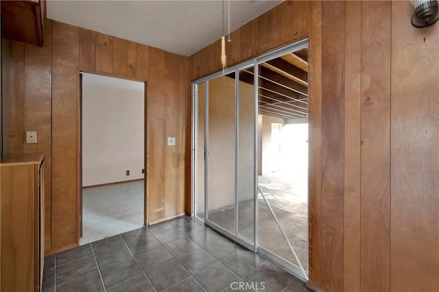 hallway with wood walls