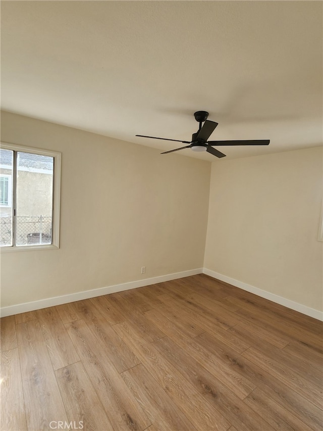 unfurnished room with light hardwood / wood-style flooring and ceiling fan