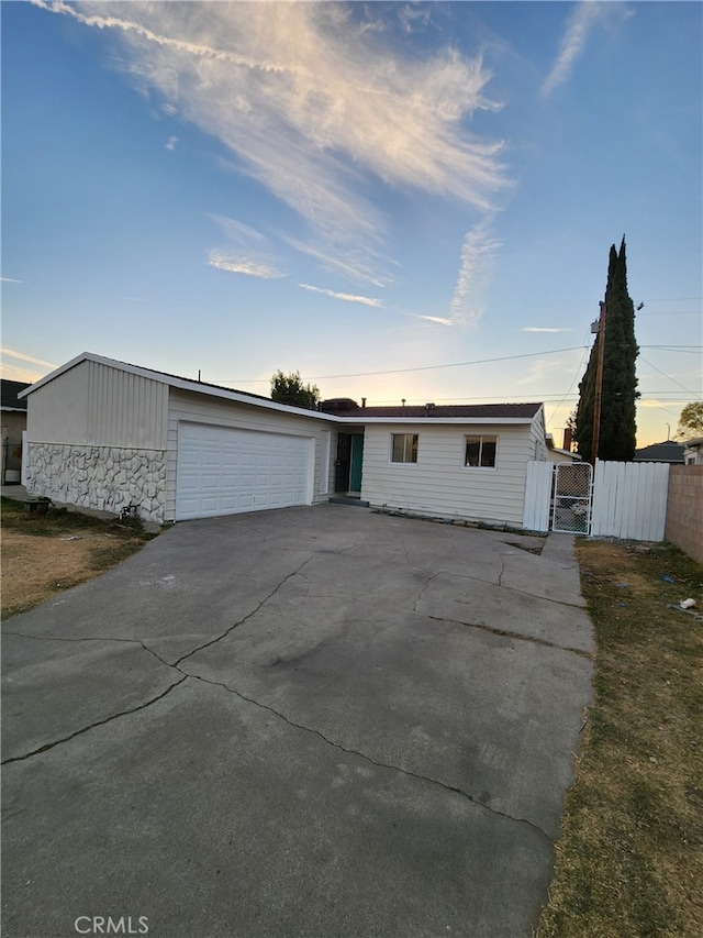 single story home featuring a garage