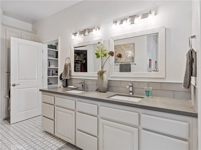 full bath featuring double vanity and a sink