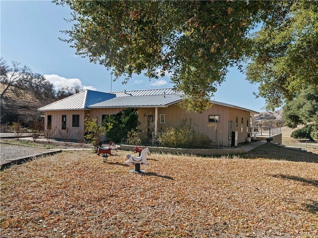 view of front of home with a standing seam roof and metal roof