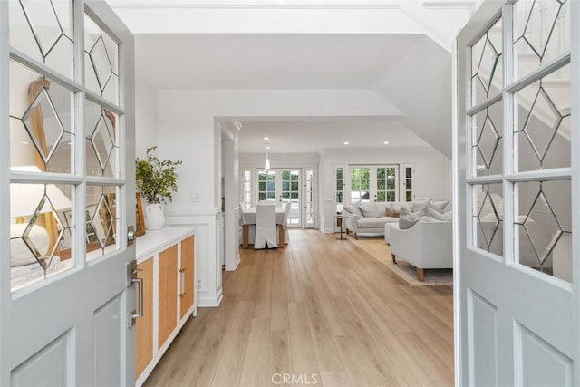 corridor with light hardwood / wood-style flooring