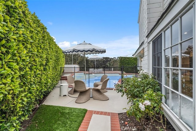 view of patio with a fenced in pool