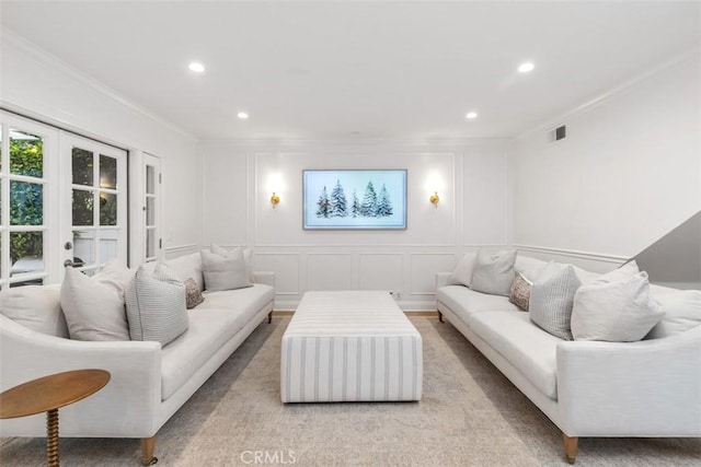 living room featuring crown molding