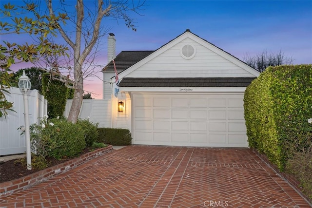 view of front of property with a garage