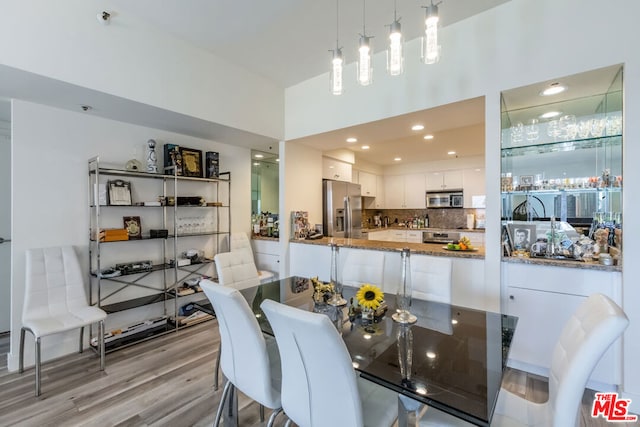 dining area with light wood-type flooring