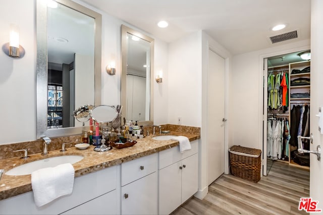 bathroom featuring vanity and wood-type flooring