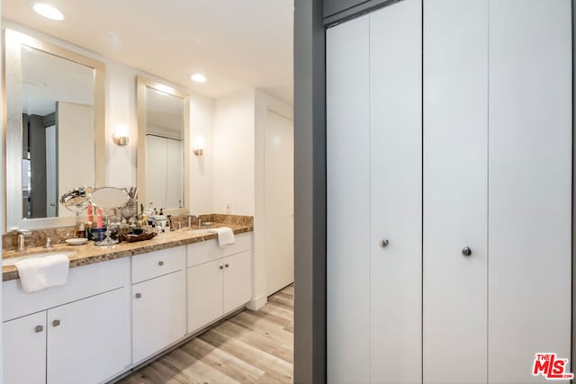 bathroom featuring vanity and wood-type flooring