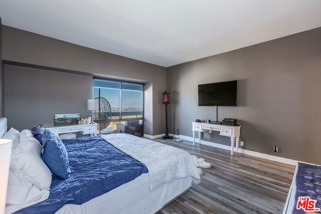 bedroom with wood-type flooring