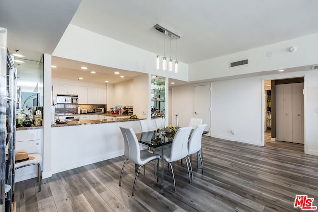 dining room featuring dark hardwood / wood-style floors