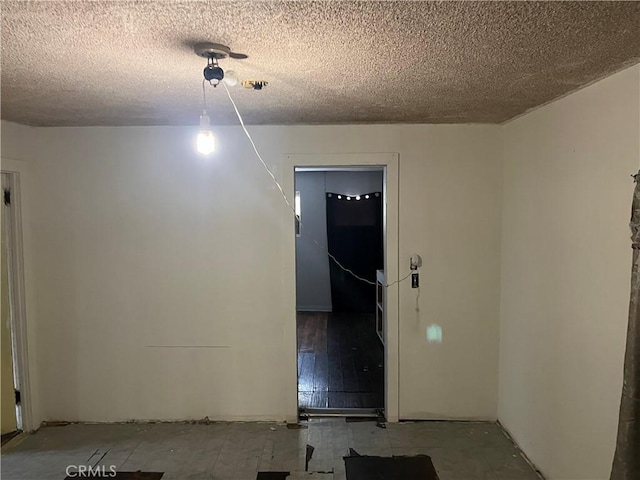 empty room with a textured ceiling