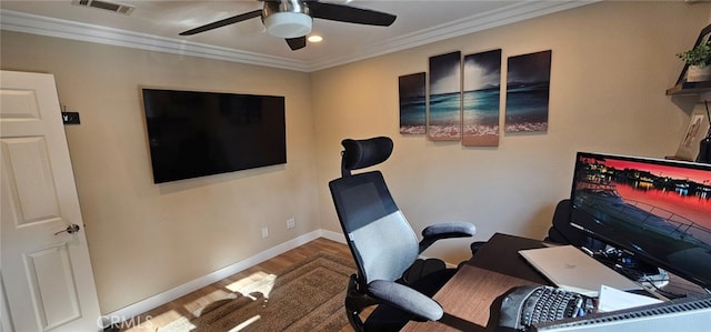 office with ornamental molding, hardwood / wood-style floors, and ceiling fan