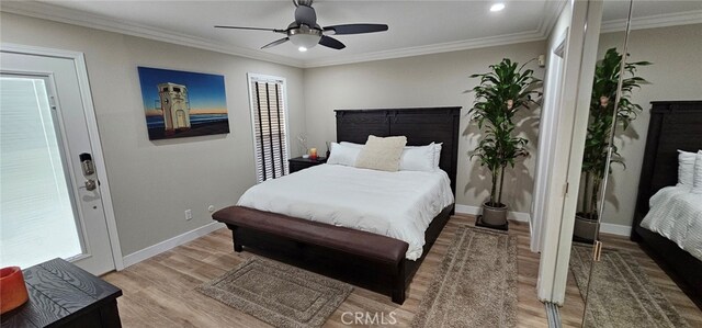 bedroom featuring wood-type flooring, ceiling fan, and crown molding