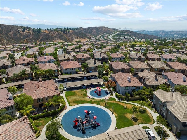 birds eye view of property with a residential view and a mountain view