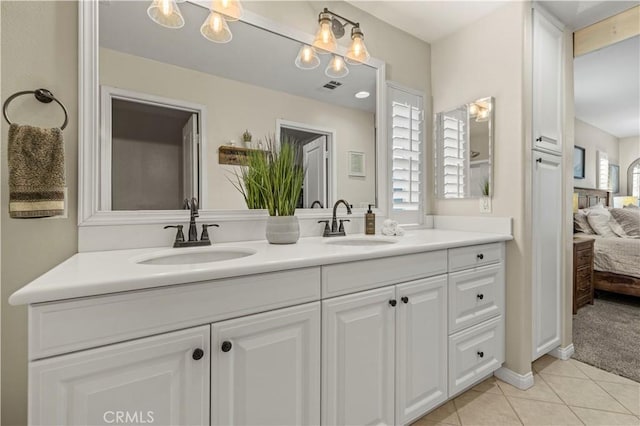 bathroom with vanity and tile patterned floors