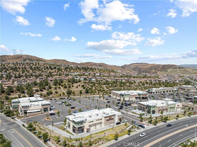 birds eye view of property with a mountain view