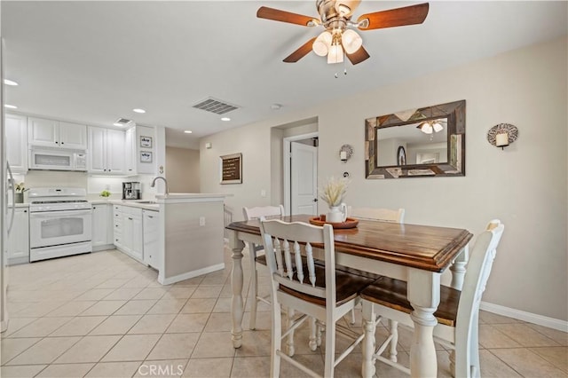 dining area featuring ceiling fan, light tile patterned flooring, recessed lighting, visible vents, and baseboards