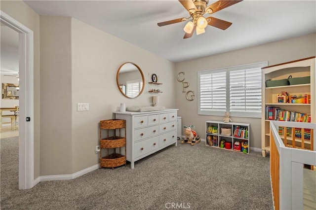 recreation room with carpet floors, baseboards, and a ceiling fan