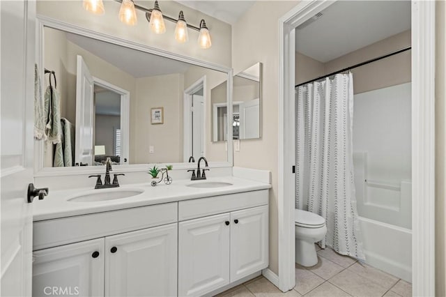 full bathroom featuring shower / bath combination with curtain, vanity, toilet, and tile patterned flooring