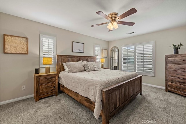 bedroom with ceiling fan and light colored carpet