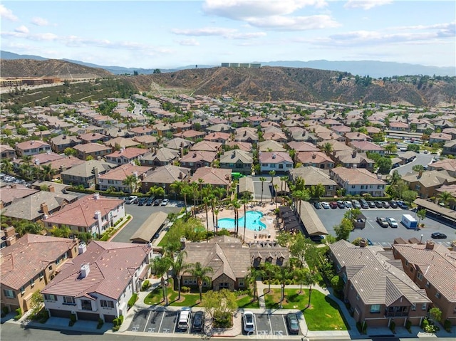 drone / aerial view with a residential view and a mountain view