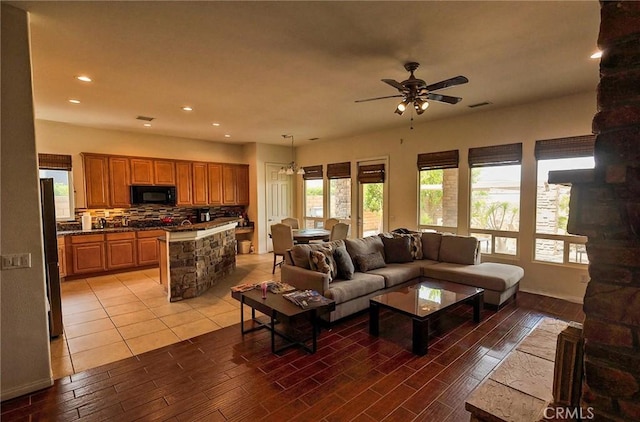 living room with hardwood / wood-style flooring and ceiling fan