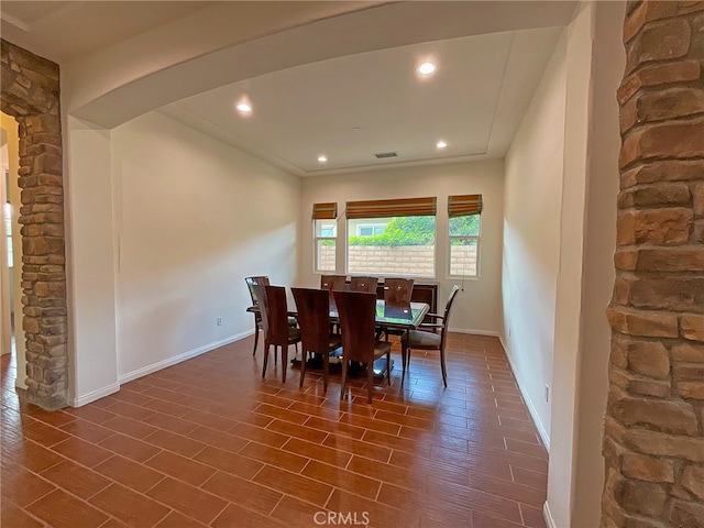 dining area with dark hardwood / wood-style flooring