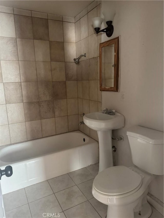 bathroom with tile patterned floors and toilet