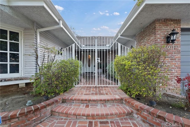 6011 Paseo La Vis, Woodland Hills, CA 91367 - property entrance with a gate