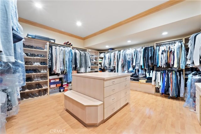 walk in closet with light wood-type flooring