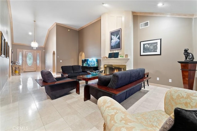 living room with crown molding, light tile patterned floors, and high vaulted ceiling