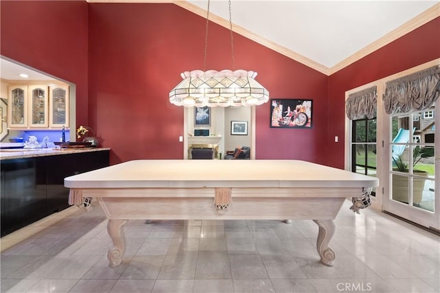 rec room featuring crown molding and vaulted ceiling