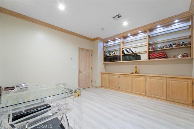6011 Paseo La Vis, Woodland Hills, CA 91367 - kitchen featuring crown molding, light countertops, light wood-type flooring, and light brown cabinets