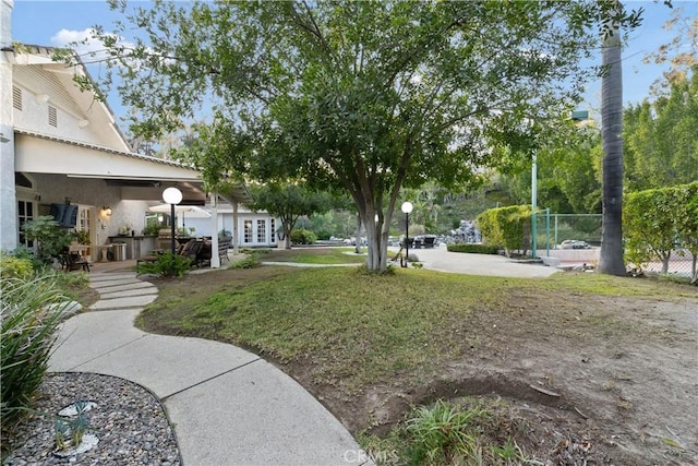 6011 Paseo La Vis, Woodland Hills, CA 91367 - view of yard with french doors and a patio area