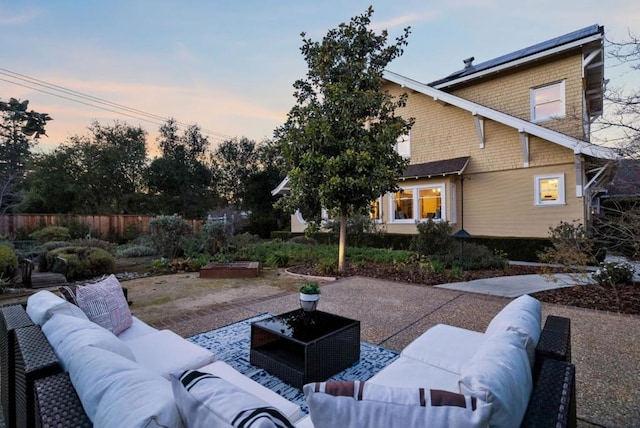 patio terrace at dusk with an outdoor hangout area