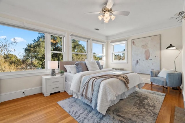 bedroom featuring ceiling fan and light wood-type flooring