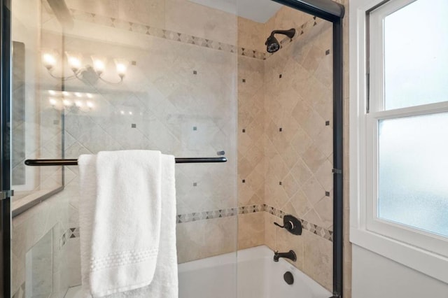 bathroom featuring shower / bath combination with glass door