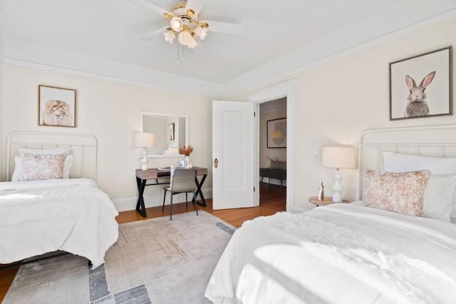 bedroom with ceiling fan and light hardwood / wood-style floors