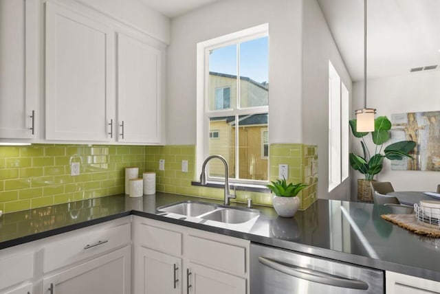 kitchen featuring white cabinetry, dishwasher, and sink