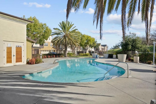 view of pool with a patio and french doors