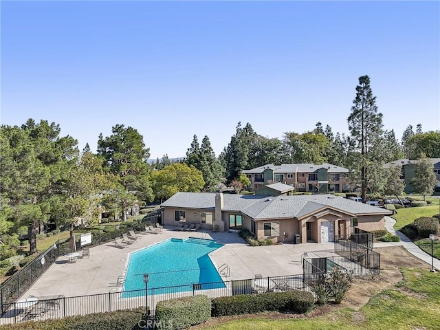 view of swimming pool featuring a patio area